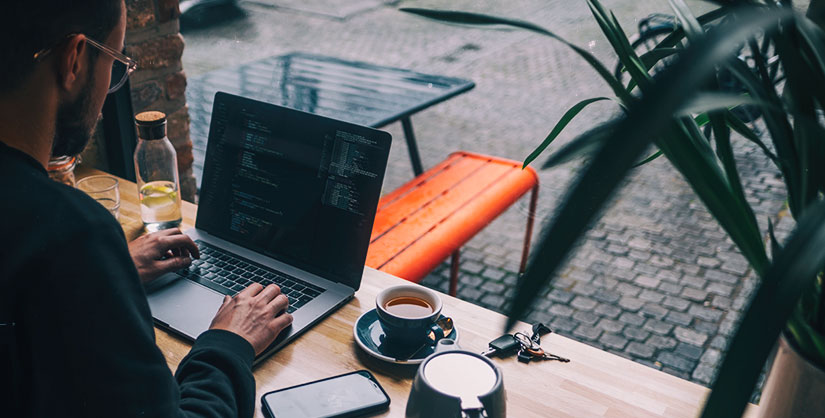 Man at cafe with laptop | Readable, free readability test