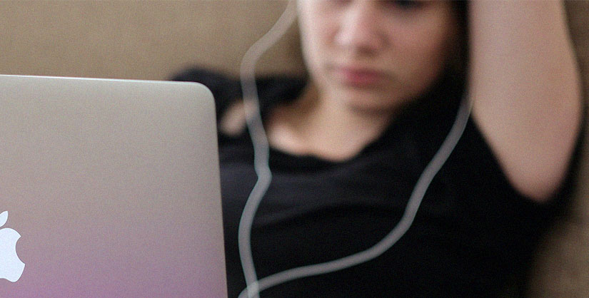 Girl with earphones in using laptop | Readable, free readability test