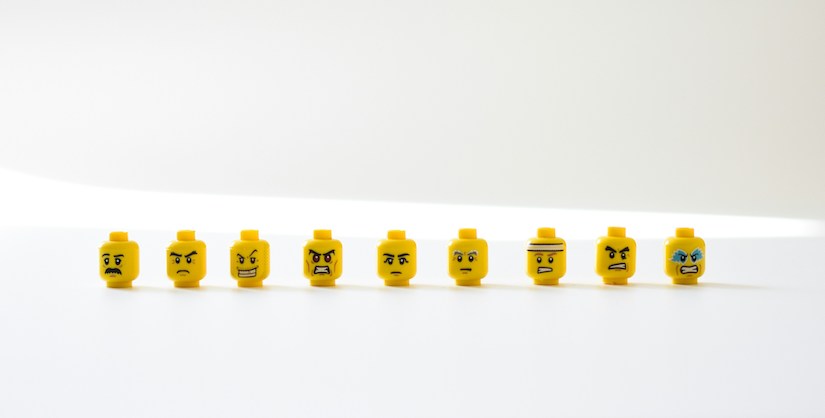 Lego heads showing different emotions, emotive language, readability blog