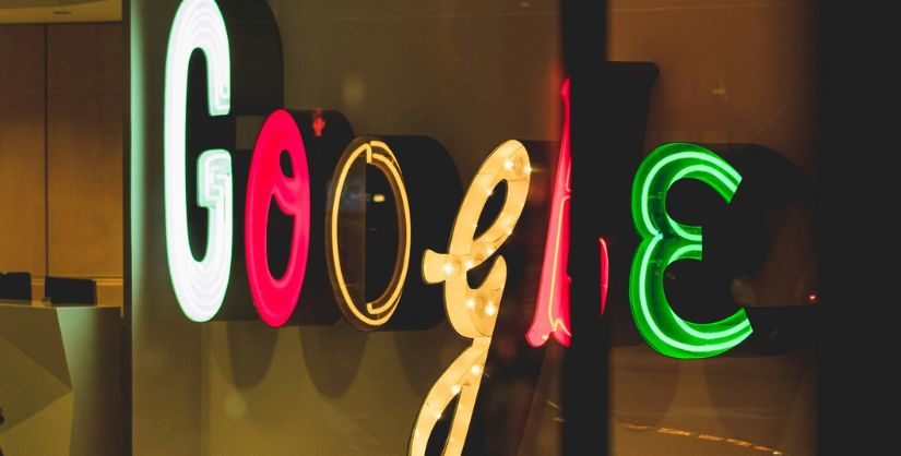 Photo of Google Logo in lights, article on Google Content Quality Update, Readable