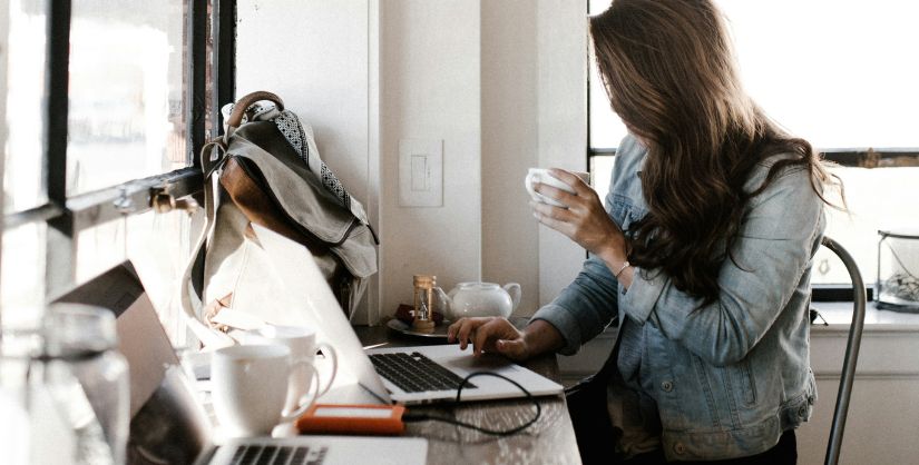 Woman in coffee shop on laptop