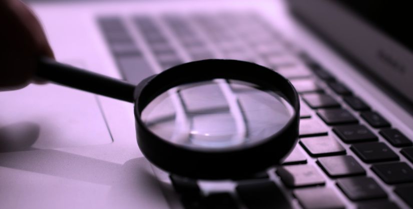 Image of magnifying glass to signify fact checking